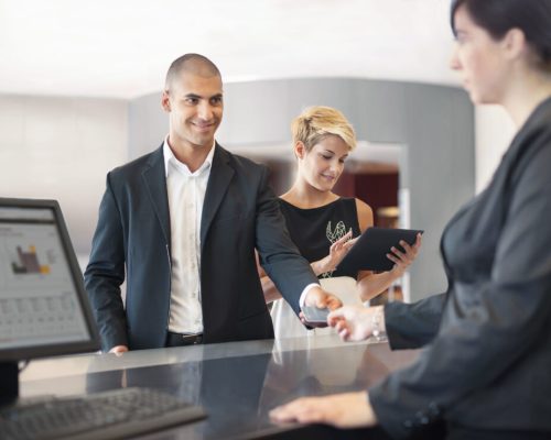 1.first_image-1024×742 Businessman checking into hotel