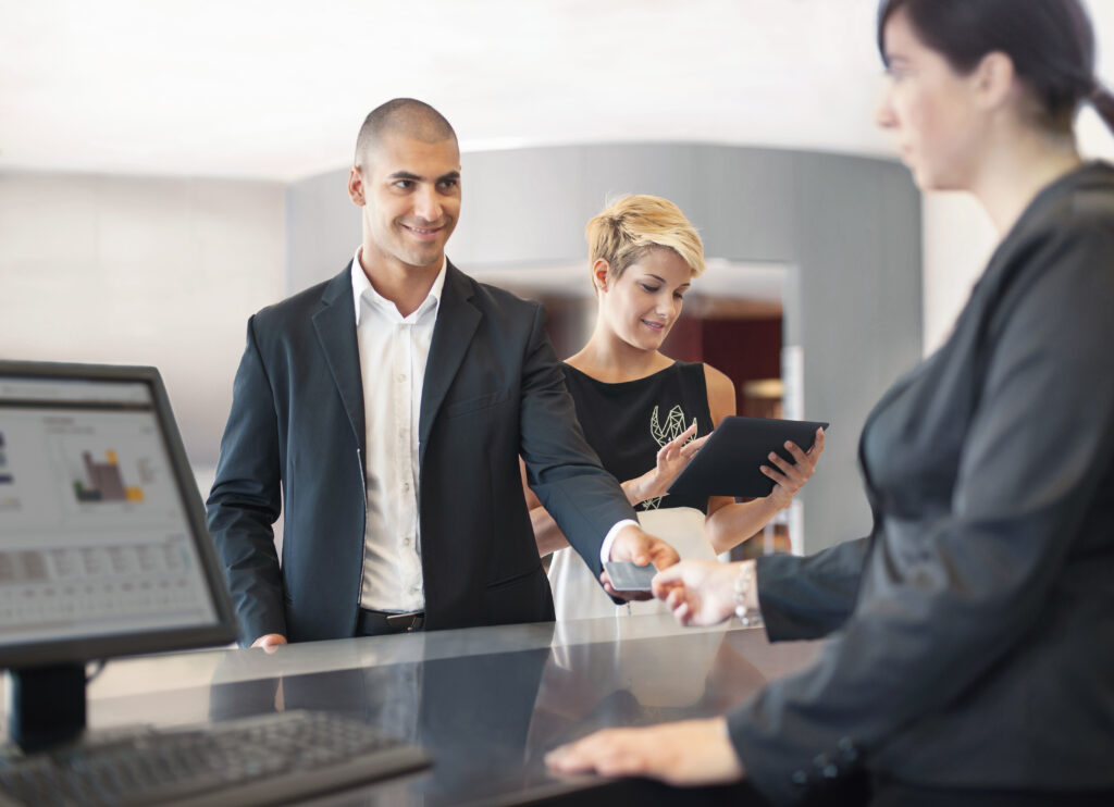 Businessman checking into hotel